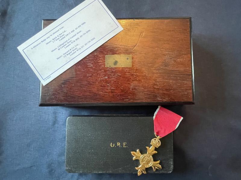 WWII CASED FULL SIZE OBE MEDAL WITH OUTERCASE MOHOGANY BOX AND CARD OF ISSUE.