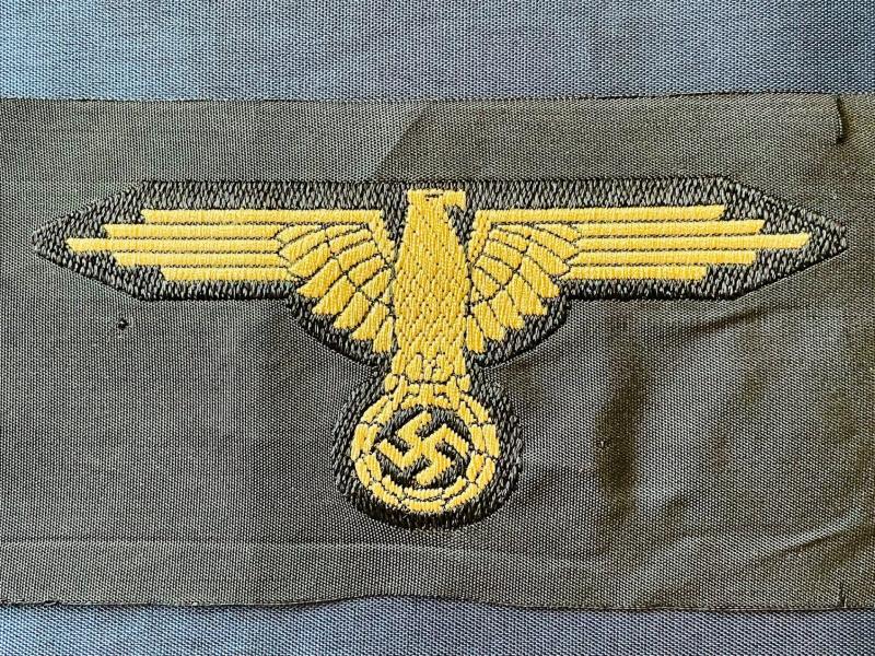 WWII GERMAN WAFFEN SS ARM EAGLE WITH SS PAPER ISSUED RZM TAG REMAINING.
