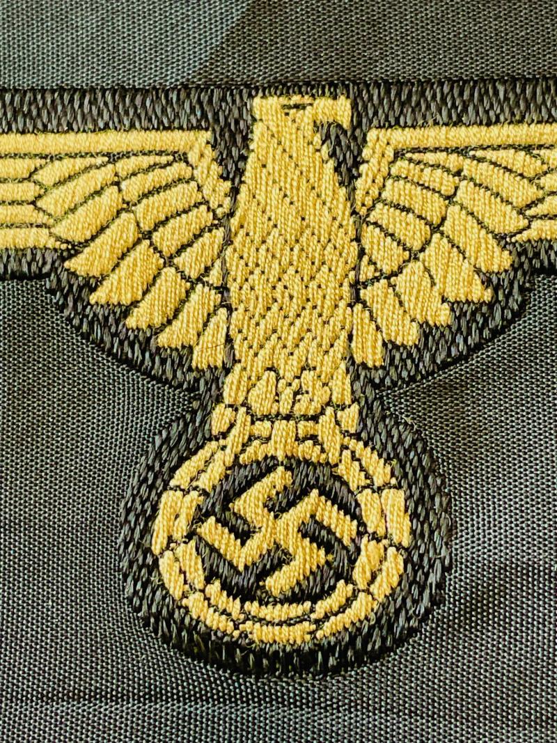 WWII GERMAN WAFFEN SS ARM EAGLE WITH SS PAPER ISSUED RZM TAG REMAINING.