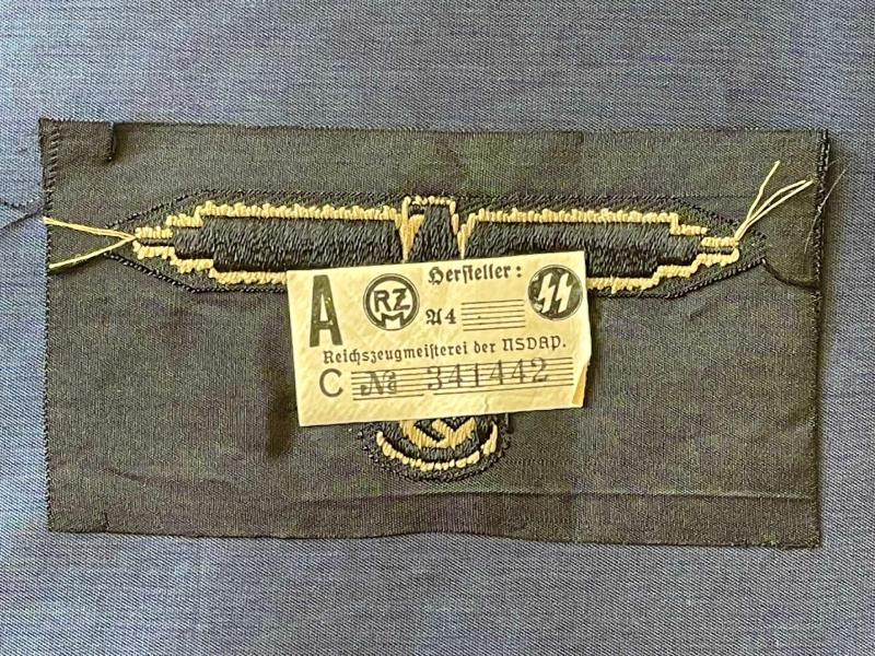 WWII GERMAN WAFFEN SS ARM EAGLE WITH SS PAPER ISSUED RZM TAG REMAINING.