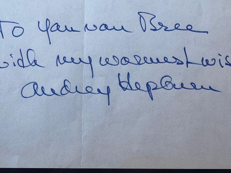 Rare Authentic Audrey Hepburn Hand Ink Signed autograph with a short inscription.